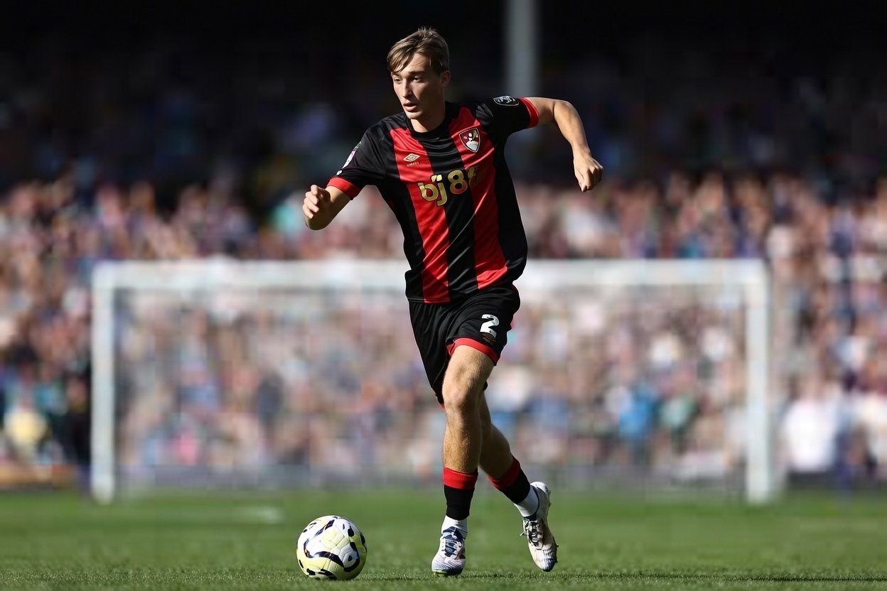 Dean Huijsean is on the pitch with the ball in his front of him