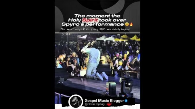 Spyro kneels during stage worship