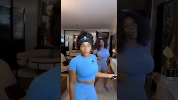 Waje and daughter wrestling playfully