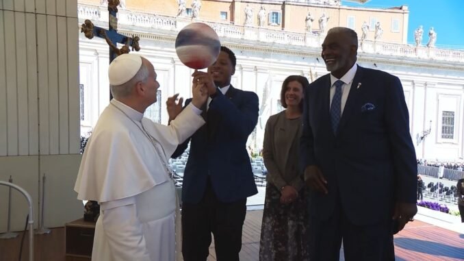 Pope Leo XIV spins ball with Globetrotters