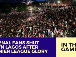 Arsenal fans celebrate on Lagos Island