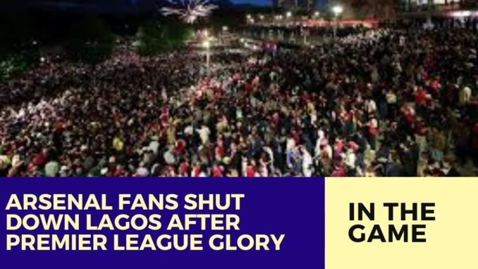 Arsenal fans celebrate on Lagos Island